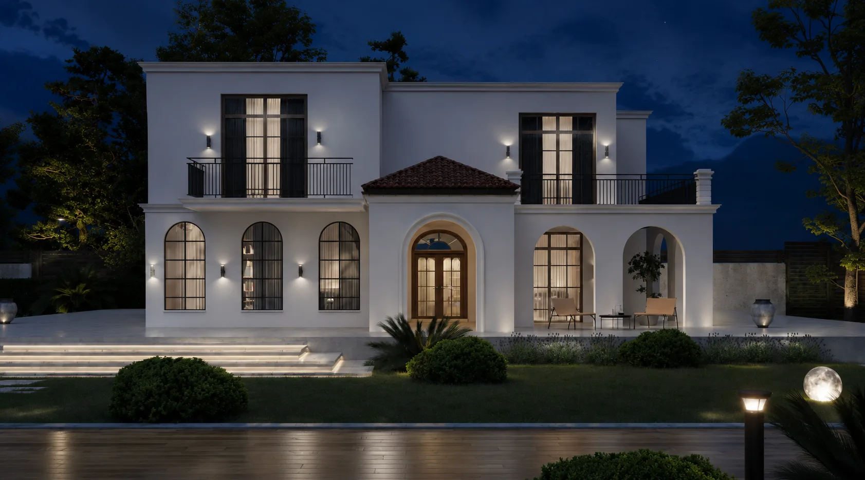 Second nighttime view emphasising glazing and warm interior light.