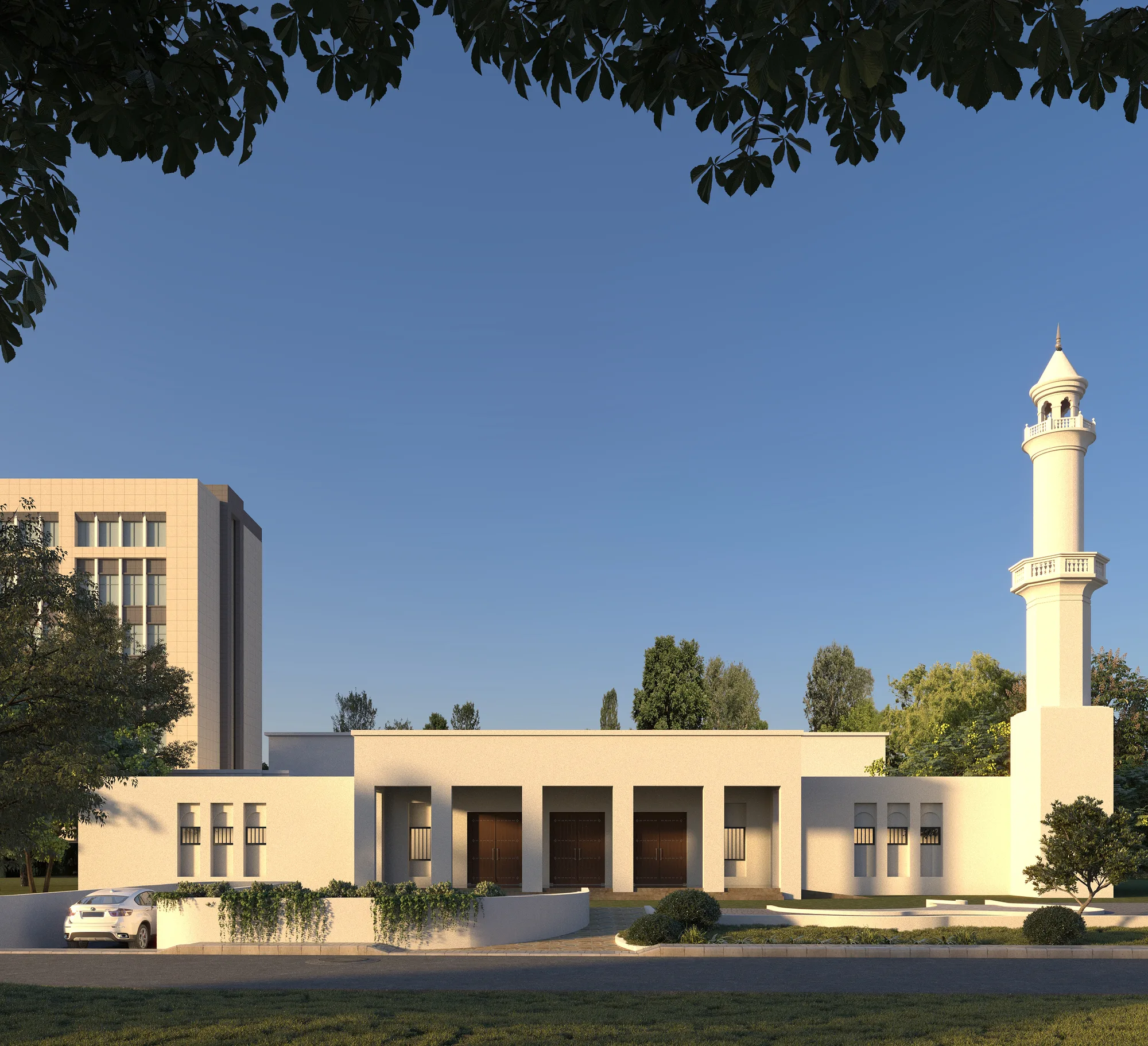 Contemporary mosque design with clean geometric façade and a landmark minaret under daylight.